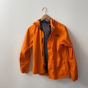 The North Face orange windbreaker for Boys